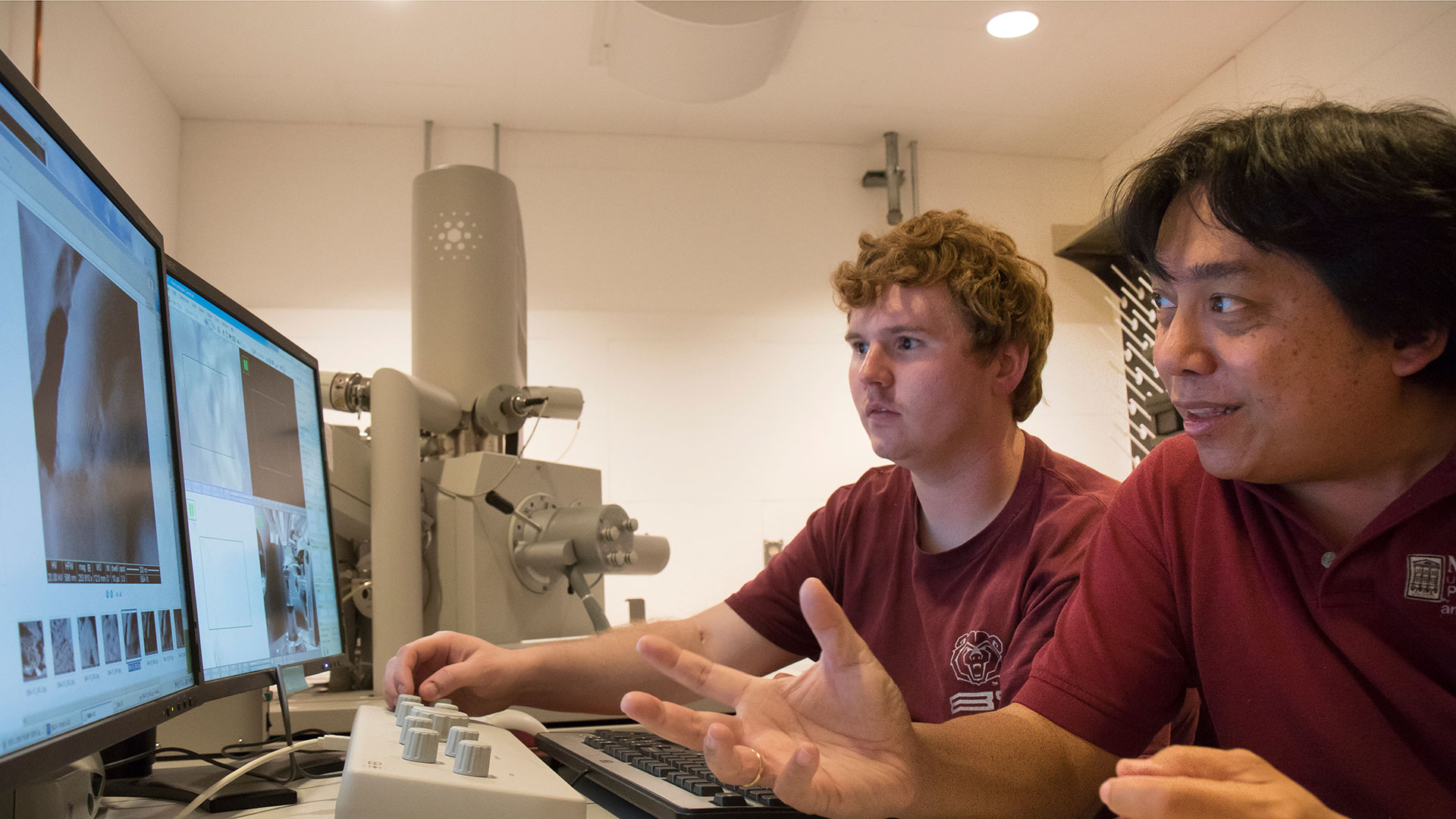 Dr. Ridwan Sakidja and graduate student Anthony Pelton examine images from the electron microscope.