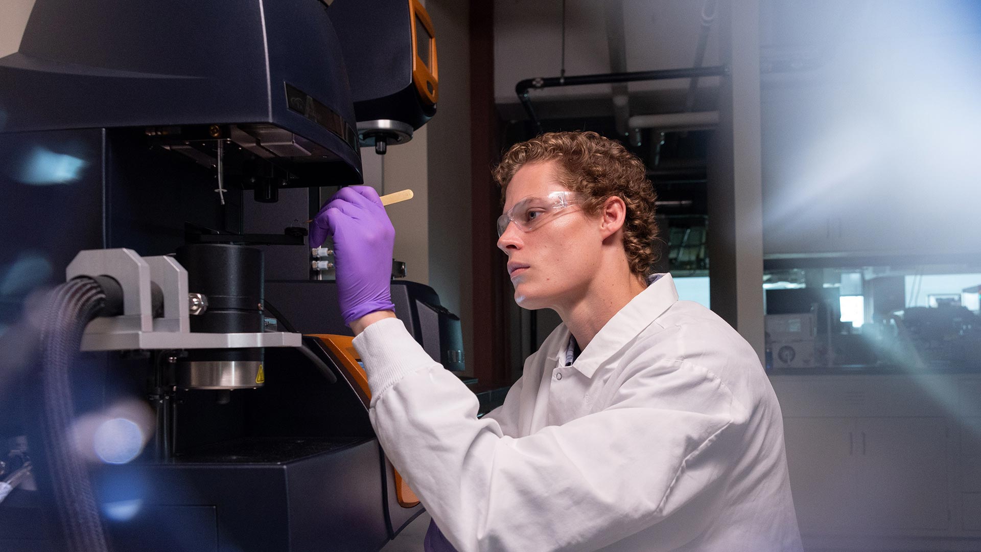 A researcher at Jordan Valley Innovation Center works diligently in a lab.