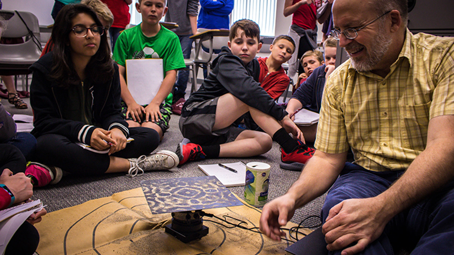 Dr. Dave Cornelison teaches a physics lesson to middle school students.