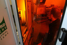 Scientist in specially lighted laboratory