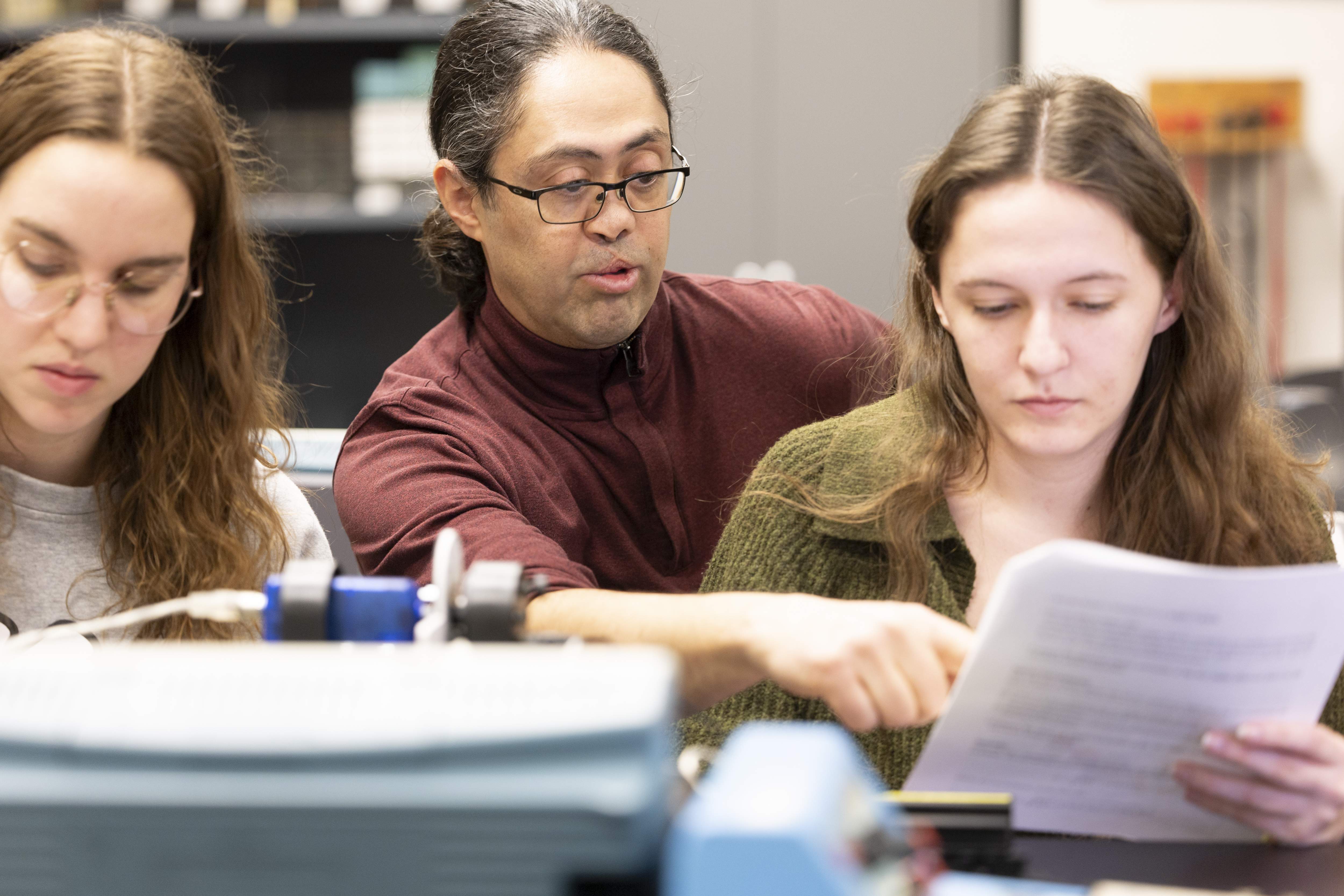 Dr. Maria Stepanova and graduate student Neva Argvala perform research on the computer to identify vibrational spectroscopy techniques.